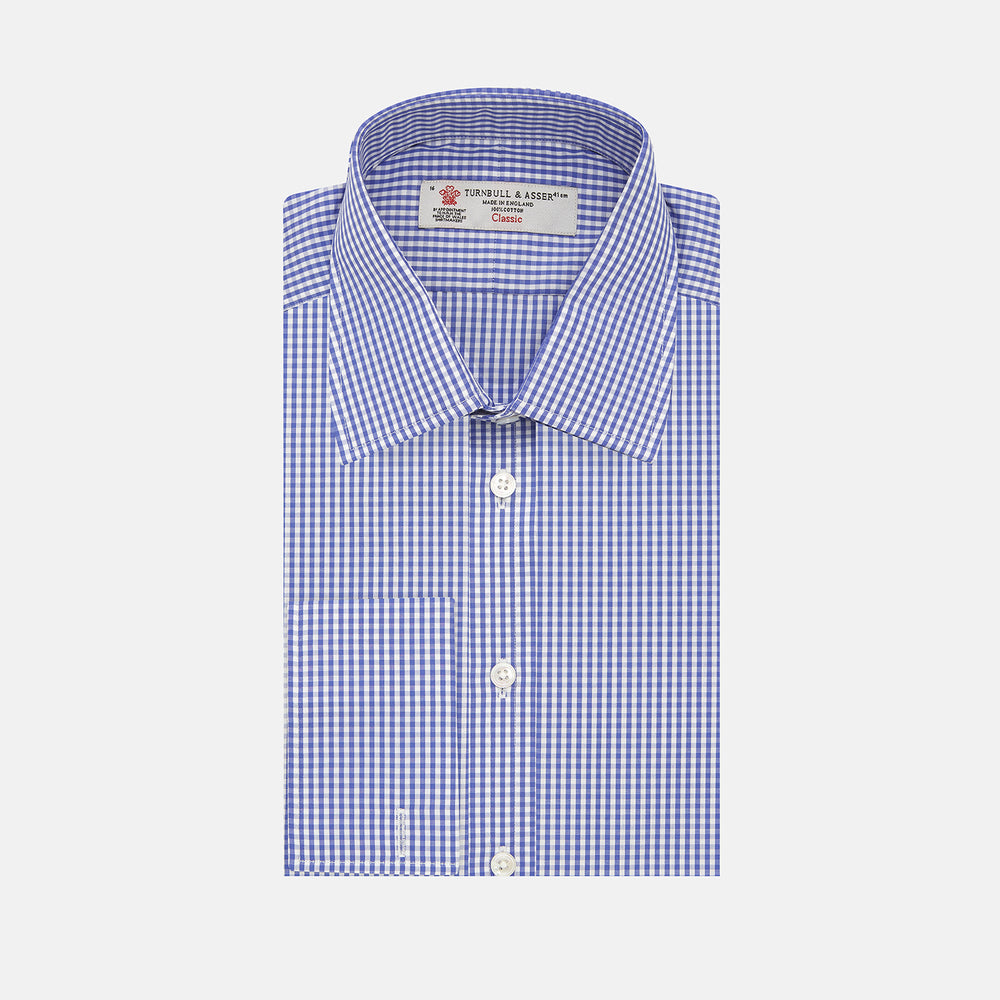 The Turnbull & Asser Mid Blue Gingham Check Shirt features a T&A collar, double cuffs, and white buttons, neatly displayed against a plain white background.