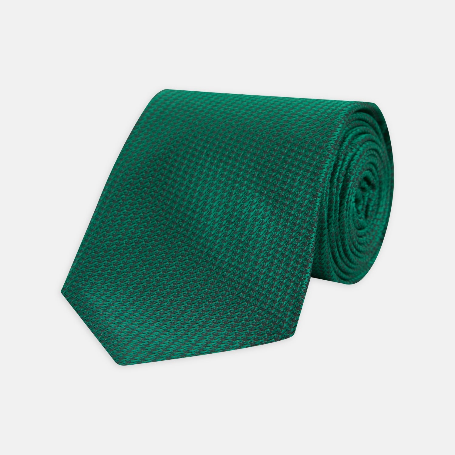 View 1 of product The Turnbull & Asser Green Lace Silk Tie, featuring a textured lace weave, is neatly rolled and displayed on a white background—an elegant, versatile accessory for any wardrobe.