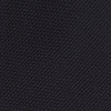 View 3 of product A neatly rolled Turnbull & Asser Navy Grenadine Silk Tie with a textured, knitted appearance is displayed on a white background.