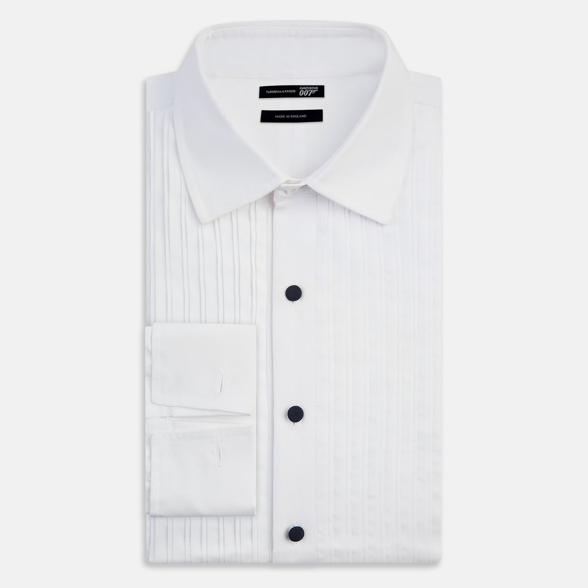 View 5 of product Turnbull & Asser UK Casino Royale White Dress Shirt in Cotton featuring a white cotton poplin design with a pleated bib front and dark buttons.