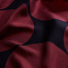 View 2 of product The DR. NO Red and Black Multi Spots Silk Pocket Square by Turnbull & Asser is handmade in England, featuring large red circles on black, with "Turnbull & Asser" and "Made in England" printed in white in the corners.