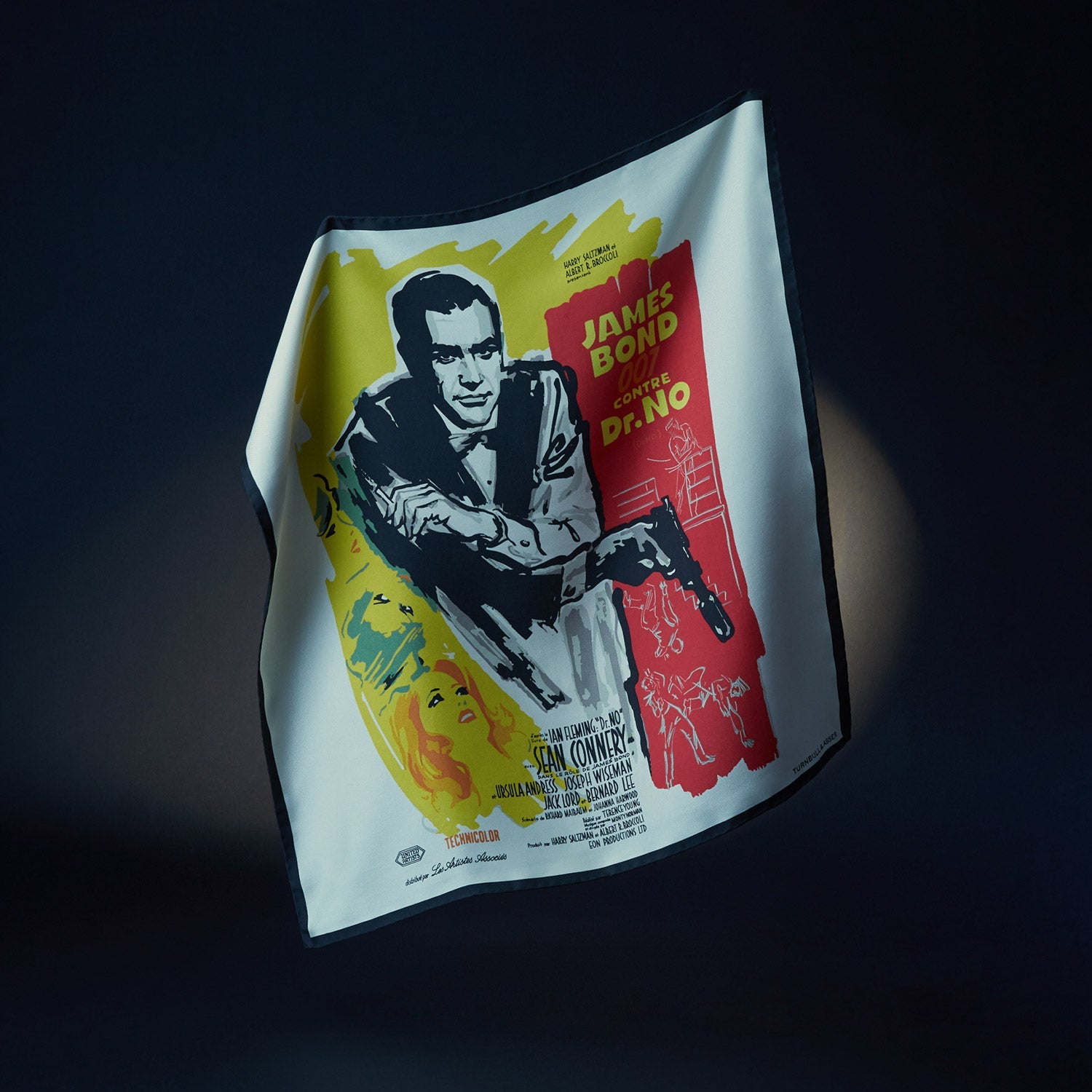 View 3 of product Vintage French James Bond 007 Dr. No poster featuring Sean Connery inspires the Turnbull & Asser DR. NO Yellow and Blue Poster Silk Pocket Square—handmade in England with bold illustrated colors.