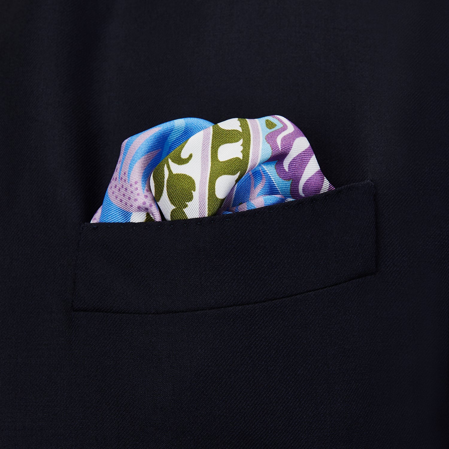 View 3 of product The Turnbull & Asser Green Multi Griffins Silk Pocket Square features blue mythical griffins at the center and decorative pink, gold, and blue borders—an ideal accessory for autumn ensembles.