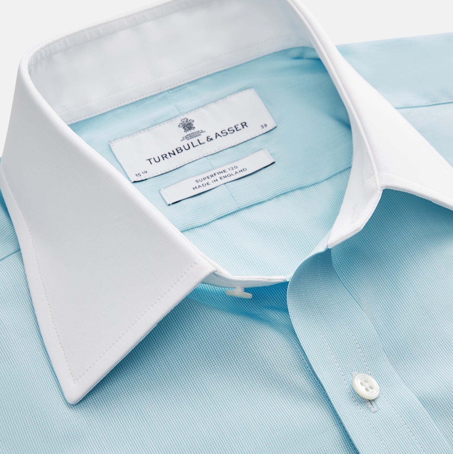 View 2 of product Green micro-check regular fit shirt by Turnbull & Asser, featuring a white T&A collar, double cuffs, and button-down front, laid flat on a white background.