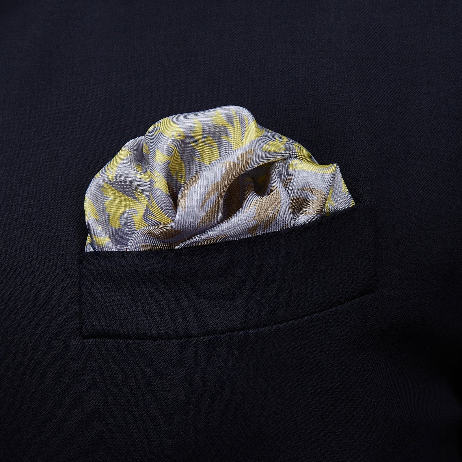 View 2 of product Turnbull & Asser’s Pale Blue and Lemon Fish Mosaic Silk Pocket Square features beige fish silhouettes forming a dense border around a white and yellow center, inspired by Mediterranean mosaics—ideal for adding artistic flair to your attire.