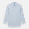 View 1 of product The Turnbull & Asser Blue Cashmerello Mayfair Shirt is a light blue cotton-cashmere blend with long sleeves, pointed collar, white buttons, and buttoned cuffs, shown on a plain white background.