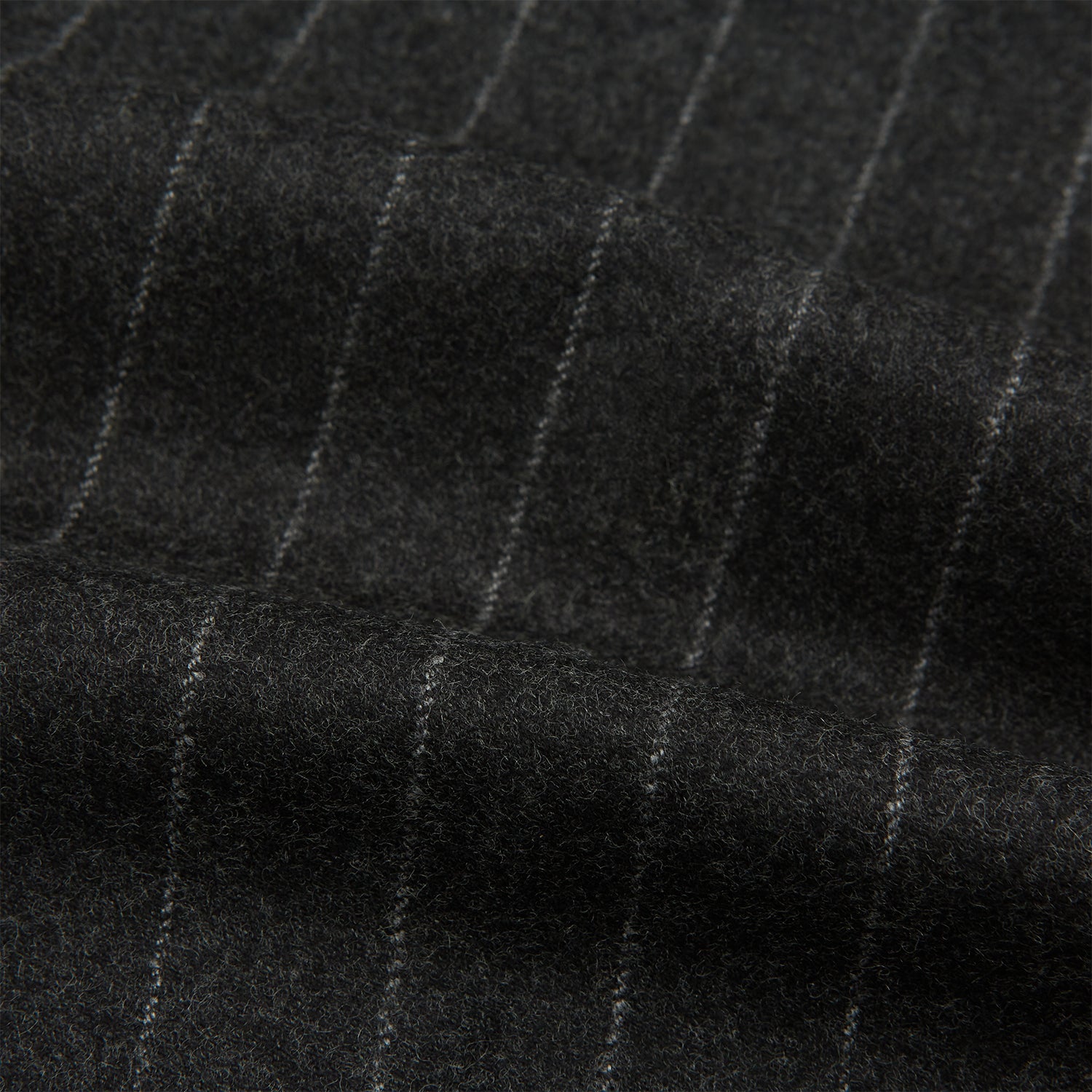 View 6 of product The Charcoal Pinstripe Henry Trousers by Turnbull & Asser feature white vertical stripes, a button and zip closure, belt loops, and side pockets, shown against a plain white background.