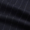 View 6 of product The Navy Pinstripe Henry Trousers by Turnbull & Asser feature vertical white stripes, a tailored fit, button closure, and belt loops. Crafted from a wool cashmere blend, they are shown against a plain white background.