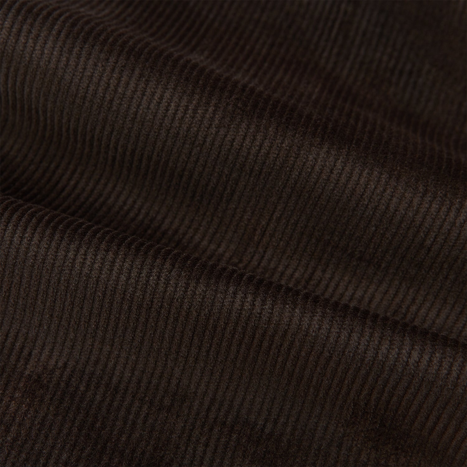 View 6 of product The Brown Corduroy Henry Trousers by Turnbull & Asser feature a slim, tailored fit with side adjusters and button closure, shown on a plain white background.