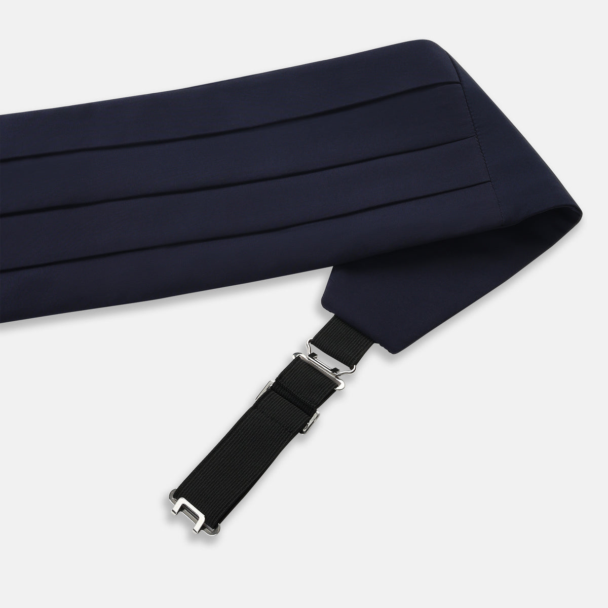 View 2 of product The Turnbull & Asser UK Casino Royale Midnight Blue Cummerbund in silk, featuring elegant horizontal pleats and showcased flat on a white background, is a sophisticated accessory crafted to enhance any formal evening attire.