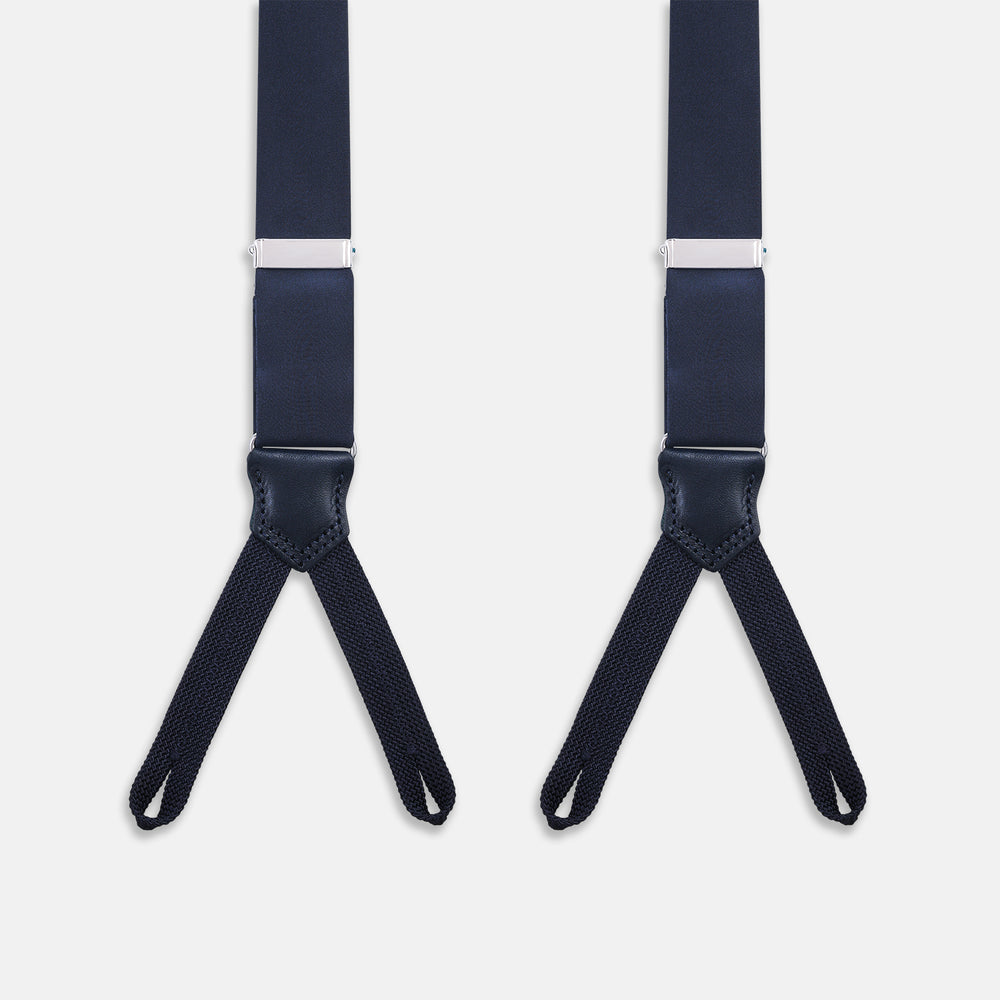 The Turnbull & Asser UK Casino Royale Midnight Blue Braces in Silk, featuring leather and elastic looped ends inspired by the iconic Casino Royale style, are displayed vertically against a white background—a sophisticated accessory for formal eveningwear.