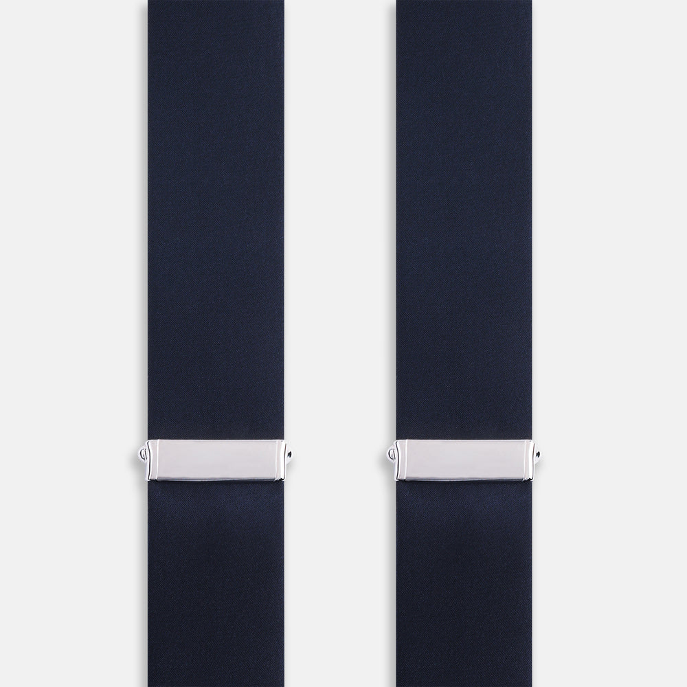 The Turnbull & Asser UK Casino Royale Midnight Blue Braces in Silk, featuring leather and elastic looped ends inspired by the iconic Casino Royale style, are displayed vertically against a white background—a sophisticated accessory for formal eveningwear.