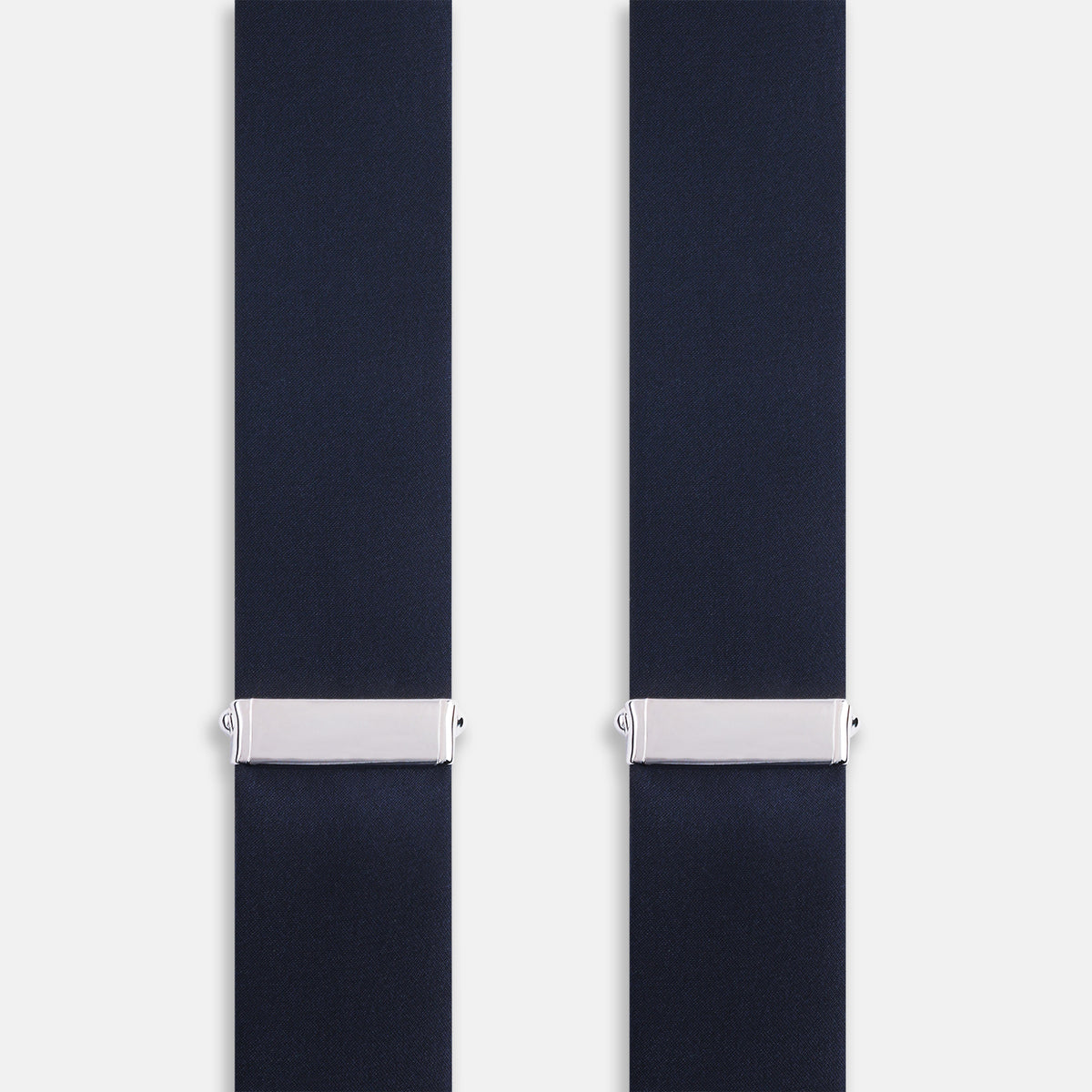 View 3 of product The Turnbull & Asser UK Casino Royale Midnight Blue Braces in Silk, featuring leather and elastic looped ends inspired by the iconic Casino Royale style, are displayed vertically against a white background—a sophisticated accessory for formal eveningwear.