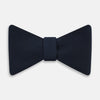 View 1 of product A classic Casino Royale Midnight Blue Bow Tie in silk by Turnbull & Asser UK, crafted from luxurious silk with a smooth texture, is neatly tied and displayed against a plain white background.