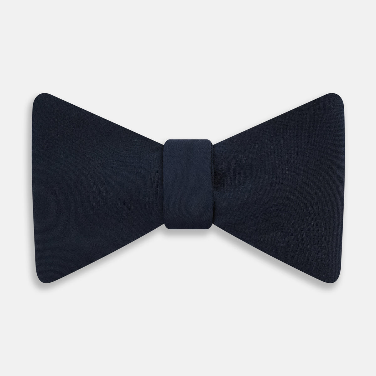 View 1 of product A classic Casino Royale Midnight Blue Bow Tie in silk by Turnbull & Asser UK, crafted from luxurious silk with a smooth texture, is neatly tied and displayed against a plain white background.