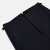 View 4 of product The Casino Royale Midnight Blue Tuxedo Trousers in Wool by Turnbull & Asser UK are shown from the back, expertly crafted from virgin wool in a signature tuxedo style, featuring two buttoned back pockets and adjustable side tabs at the waistband.