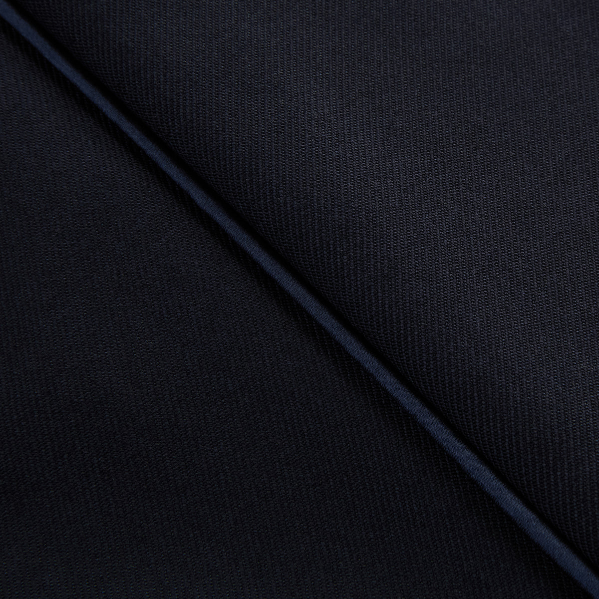 View 8 of product The Casino Royale Midnight Blue Tuxedo Trousers in Wool by Turnbull & Asser UK are shown from the back, expertly crafted from virgin wool in a signature tuxedo style, featuring two buttoned back pockets and adjustable side tabs at the waistband.