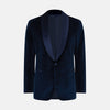 View 1 of product Turnbull & Asser UK’s Casino Royale Midnight Blue Tuxedo Jacket in Cotton Velvet, featuring a single button closure and a luxurious silk-satin shawl lapel, is showcased against a plain white background.