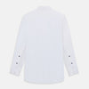 View 9 of product The Casino Royale White Dress Shirt in Cotton by Turnbull & Asser UK is a long-sleeve white dress shirt, crafted from crisp white cotton poplin with a pleated bib front, black buttons, and a classic collar, shown laid flat on a white background.