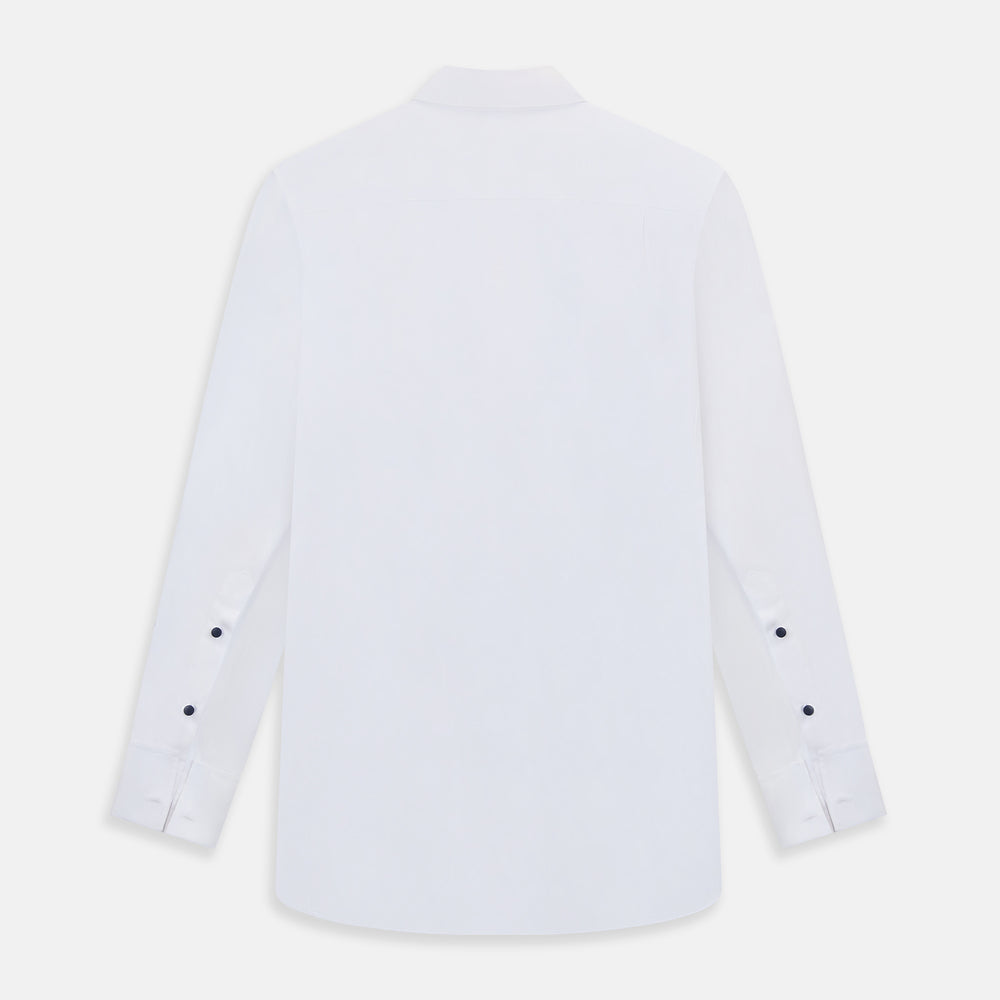 The Casino Royale White Dress Shirt in Cotton by Turnbull & Asser UK is a long-sleeve white dress shirt, crafted from crisp white cotton poplin with a pleated bib front, black buttons, and a classic collar, shown laid flat on a white background.