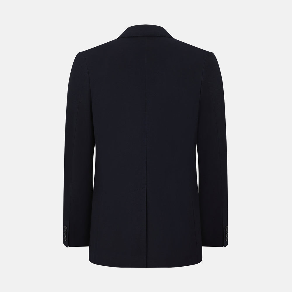 The Navy Knitted London Blazer by Turnbull & Asser features notch lapels, two buttons, and three front pockets—ideal for spring or summer contemporary looks. Displayed on a plain white background.