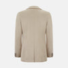 View 3 of product The Turnbull & Asser UK Sand Silk & Cotton Bath Blazer showcases Italian craftsmanship with notched lapels, two front buttons, large patch pockets, and a chest pocket, all set against a plain white background.