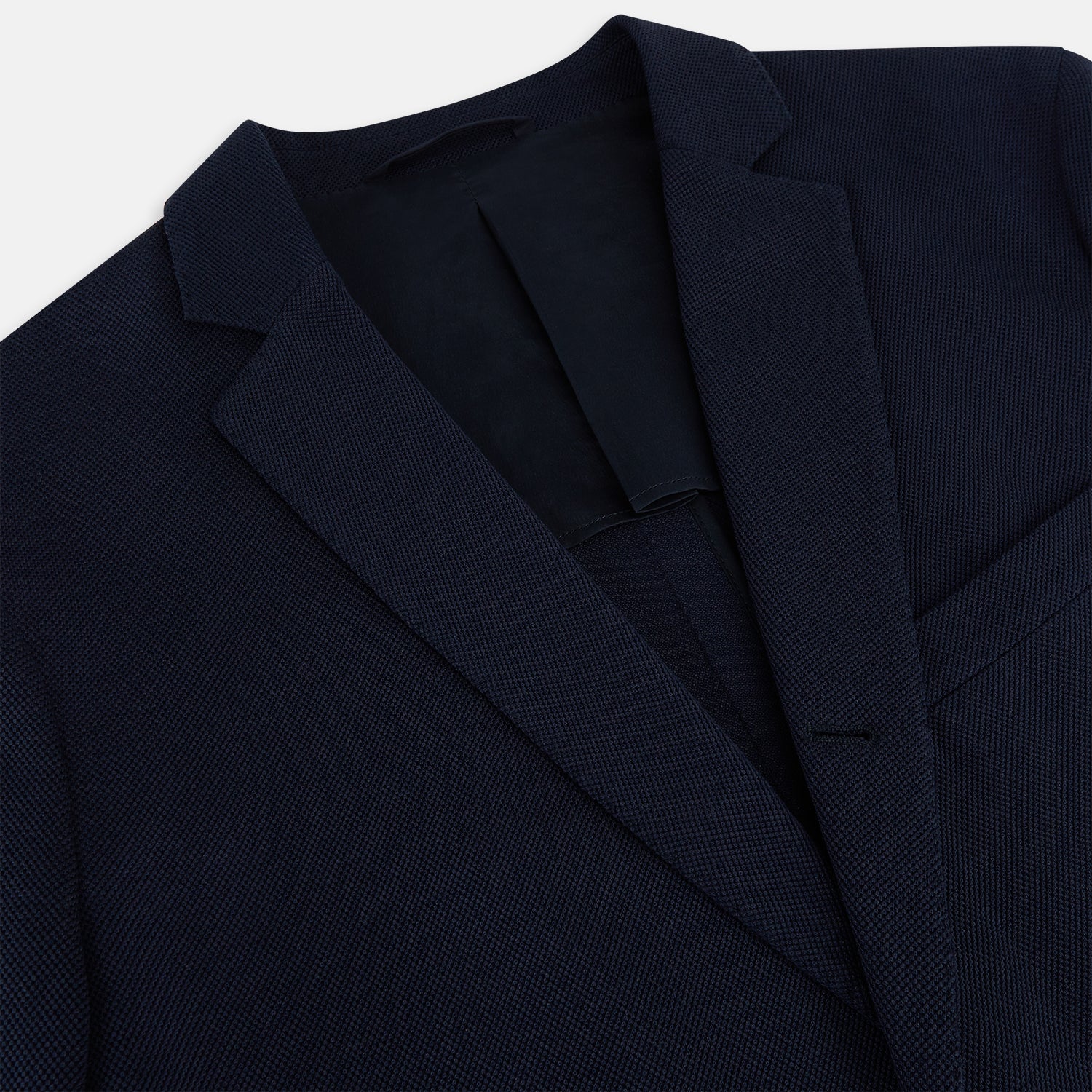View 2 of product The Turnbull & Asser UK Navy Silk & Cotton Bath Blazer for men features notch lapels, two front pockets, a chest pocket, and a single-breasted button closure, crafted with refined Italian tailoring and shown on a white background.