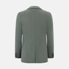 View 3 of product The Turnbull & Asser UK Sage Silk & Cotton Bath Blazer is a single-breasted Italian-tailored piece in olive green, featuring notch lapels, two front patch pockets, a chest pocket, and two buttons, shown on a plain white background.