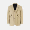View 1 of product Riviera Sand Oversized Blazer in Cotton by Turnbull & Asser UK, featuring two spacious front pockets, a single chest pocket, and a classic notched lapel. Expertly tailored from premium cotton-nylon stretch fabric, this blazer is shown front-facing against a clean white background—an essential piece for achieving effortless sophistication.