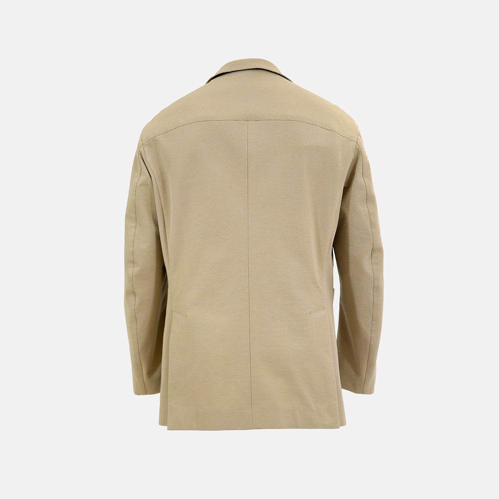 Riviera Sand Oversized Blazer in Cotton by Turnbull & Asser UK, featuring two spacious front pockets, a single chest pocket, and a classic notched lapel. Expertly tailored from premium cotton-nylon stretch fabric, this blazer is shown front-facing against a clean white background—an essential piece for achieving effortless sophistication.