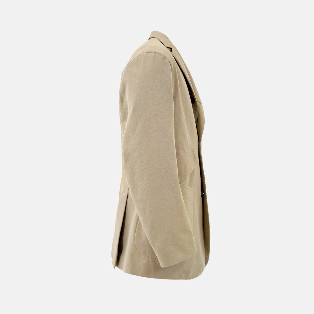Riviera Sand Oversized Blazer in Cotton by Turnbull & Asser UK, featuring two spacious front pockets, a single chest pocket, and a classic notched lapel. Expertly tailored from premium cotton-nylon stretch fabric, this blazer is shown front-facing against a clean white background—an essential piece for achieving effortless sophistication.