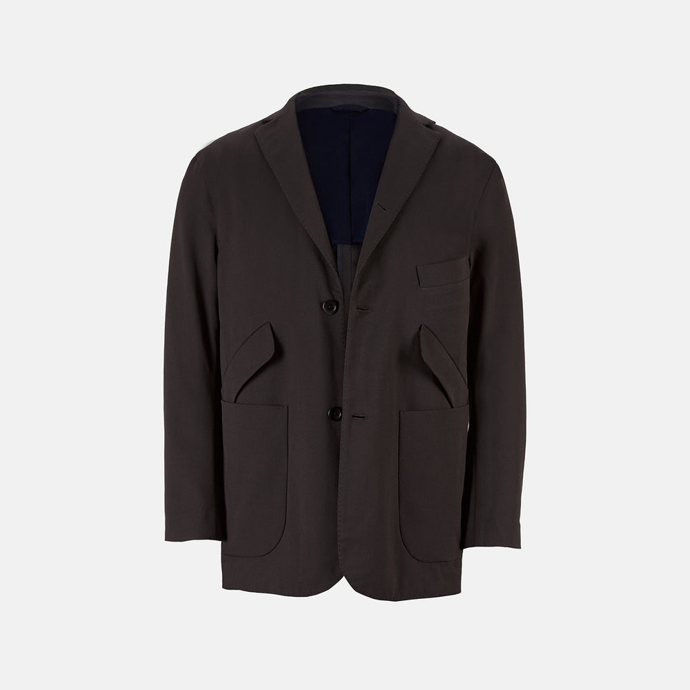 Introducing the Riviera Chocolate Oversized Blazer in Cotton by Turnbull & Asser UK—a dark brown blazer featuring two front buttons, three patch pockets, and notch lapels. Crafted from a cotton-nylon stretch fabric and showcased against a plain white background, this piece is a timeless addition to your autumn wardrobe.