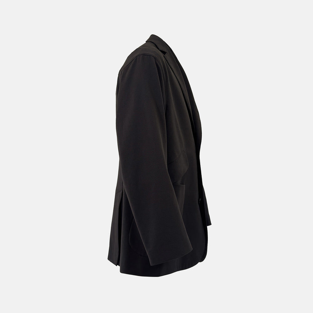 Introducing the Riviera Chocolate Oversized Blazer in Cotton by Turnbull & Asser UK—a dark brown blazer featuring two front buttons, three patch pockets, and notch lapels. Crafted from a cotton-nylon stretch fabric and showcased against a plain white background, this piece is a timeless addition to your autumn wardrobe.