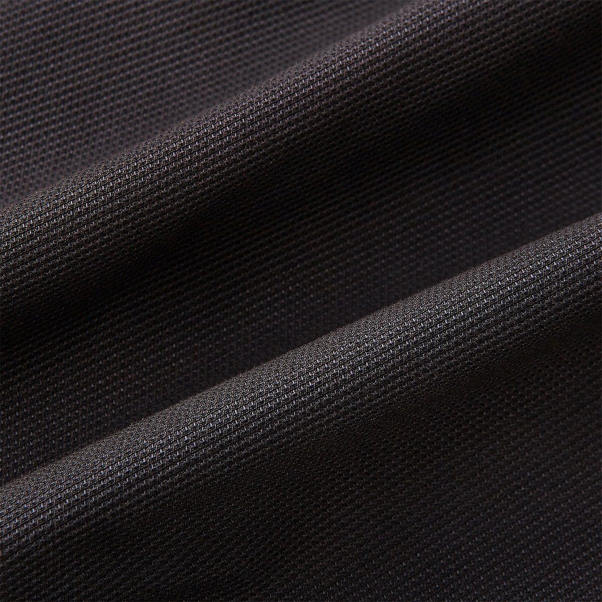 View 9 of product Introducing the Riviera Chocolate Oversized Blazer in Cotton by Turnbull & Asser UK—a dark brown blazer featuring two front buttons, three patch pockets, and notch lapels. Crafted from a cotton-nylon stretch fabric and showcased against a plain white background, this piece is a timeless addition to your autumn wardrobe.