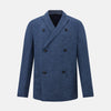 View 1 of product The Henley Denim Blazer in Linen by Turnbull & Asser UK features a double-breasted design with six black buttons, notch lapels, two front pockets, and a chest pocket—a timeless staple for effortless British summer dressing—displayed on a plain white background.