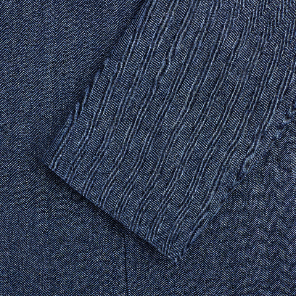 The Henley Denim Blazer in Linen by Turnbull & Asser UK features a double-breasted design with six black buttons, notch lapels, two front pockets, and a chest pocket—a timeless staple for effortless British summer dressing—displayed on a plain white background.