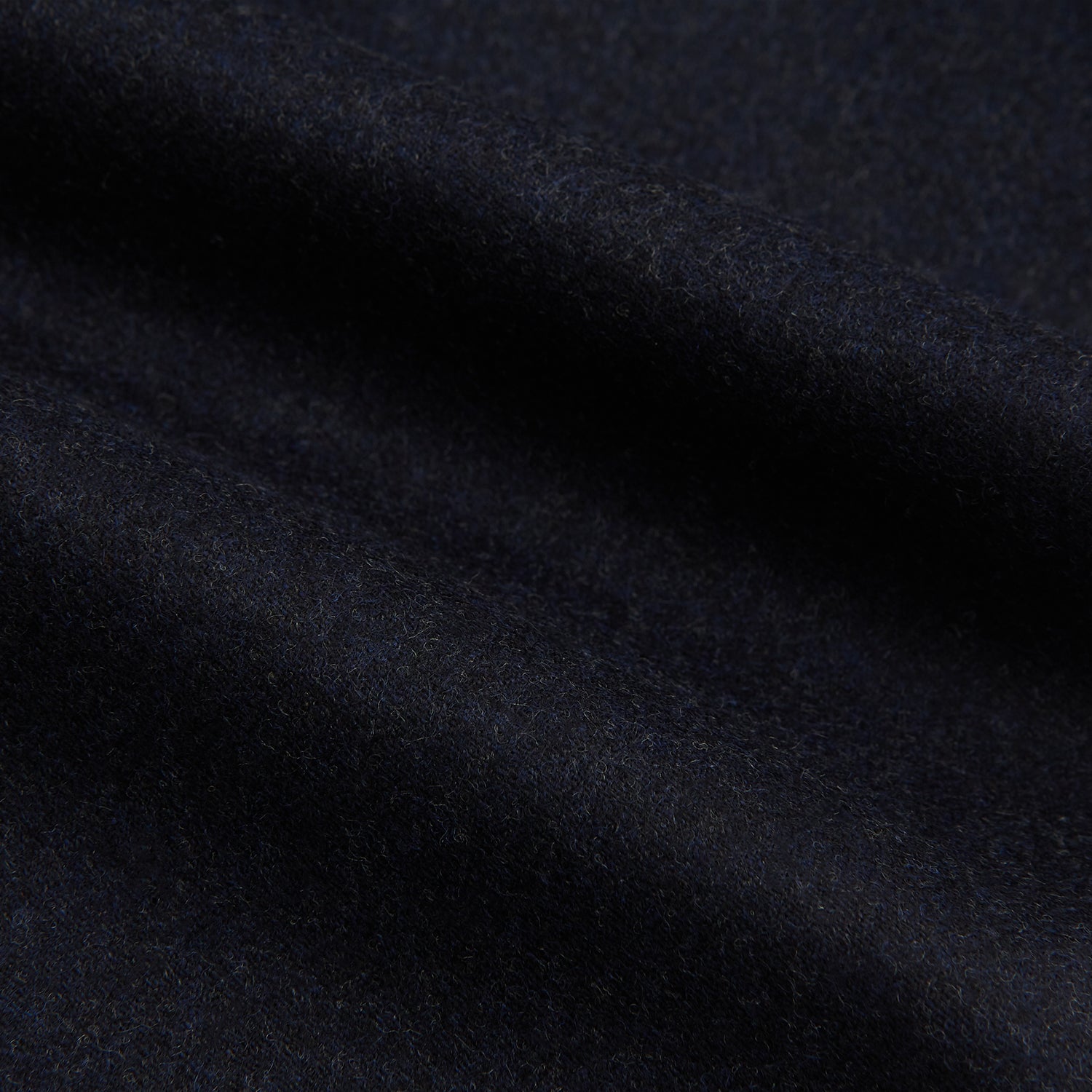 View 6 of product The Turnbull & Asser Navy Henry Trousers are tailored from a luxurious wool-cashmere blend, featuring front pleats, straight legs, and a button closure. Shown here laid flat on a white background.