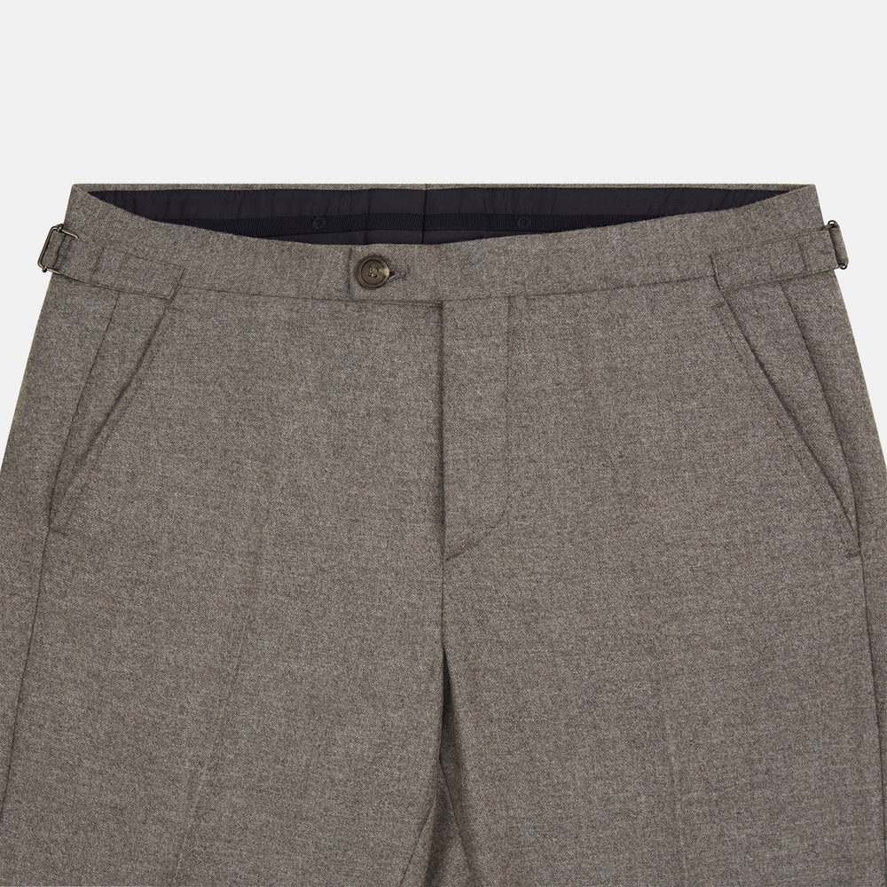The Stone Henry Trousers by Turnbull & Asser, in a wool-cashmere blend, feature pleats, a button closure, belt loops, and straight legs, shown laid flat on a white background.