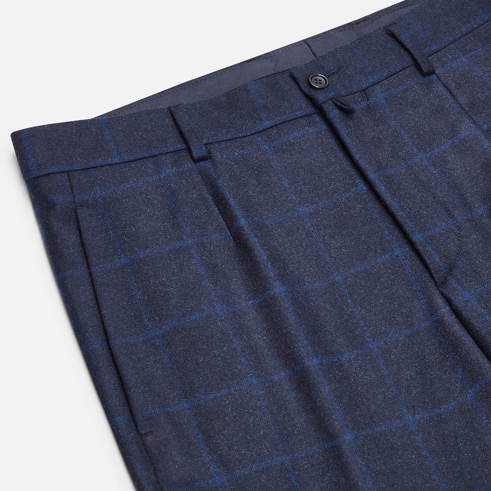 Turnbull & Asser Blue Checked Navy Rupert Trousers, crafted from a premium wool-cashmere blend, feature a subtle Prince of Wales check, belt loops, button closure, and straight legs. Shown on a plain white background.