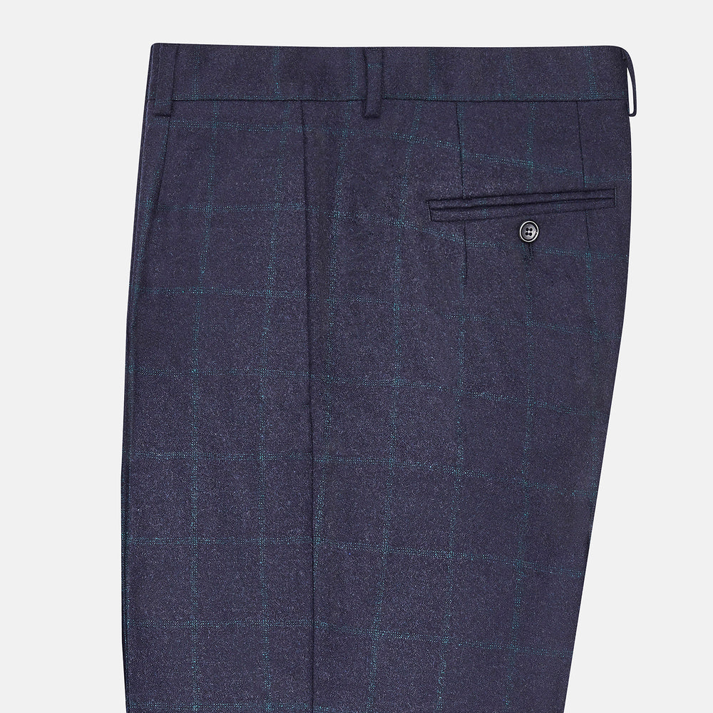 Turnbull & Asser’s Midnight and Green Check Rupert Trousers feature front pleats, belt loops, a button closure, and are finely crafted from wool and cashmere, shown against a plain white background.