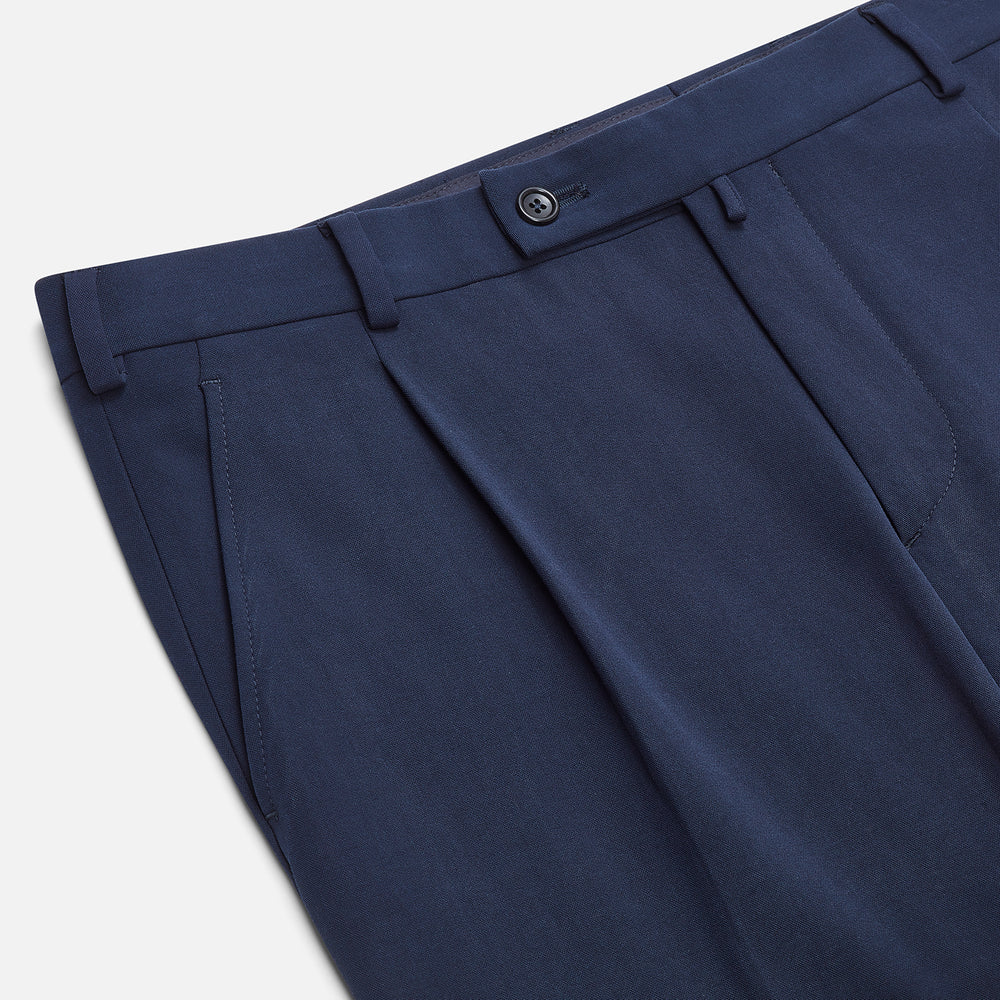 Turnbull & Asser Navy George Trousers in a cotton blend with a single pleat, button and zipper closure, belt loops, and crease detailing down each leg, shown on a plain white background.