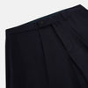 View 2 of product Turnbull & Asser UK Edward Navy Pleated Trousers in Wool Gabardine featuring a button closure, pleated front, and sharp pressed creases.