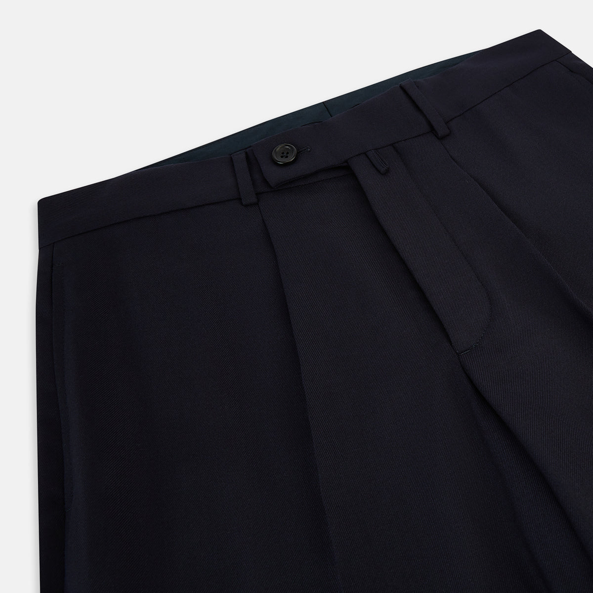 View 2 of product Turnbull & Asser UK Edward Navy Pleated Trousers in Wool Gabardine featuring a button closure, pleated front, and sharp pressed creases.