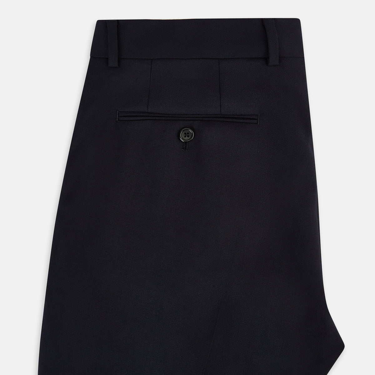 View 5 of product Turnbull & Asser UK Edward Navy Pleated Trousers in Wool Gabardine featuring a button closure, pleated front, and sharp pressed creases.