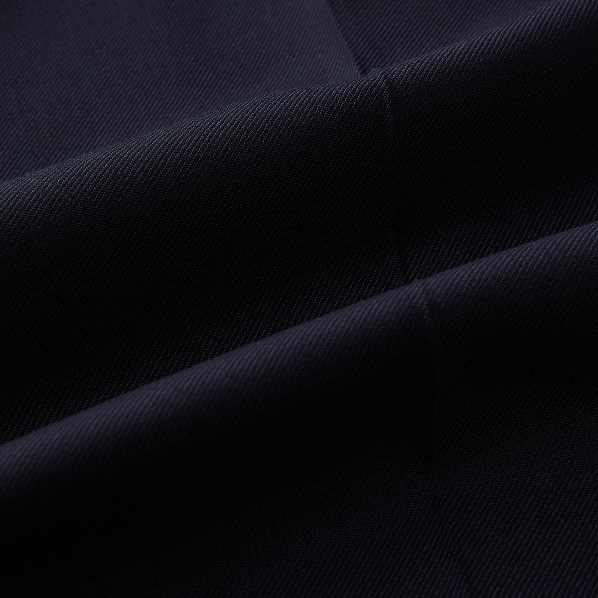 View 7 of product Turnbull & Asser UK Edward Navy Pleated Trousers in Wool Gabardine featuring a button closure, pleated front, and sharp pressed creases.