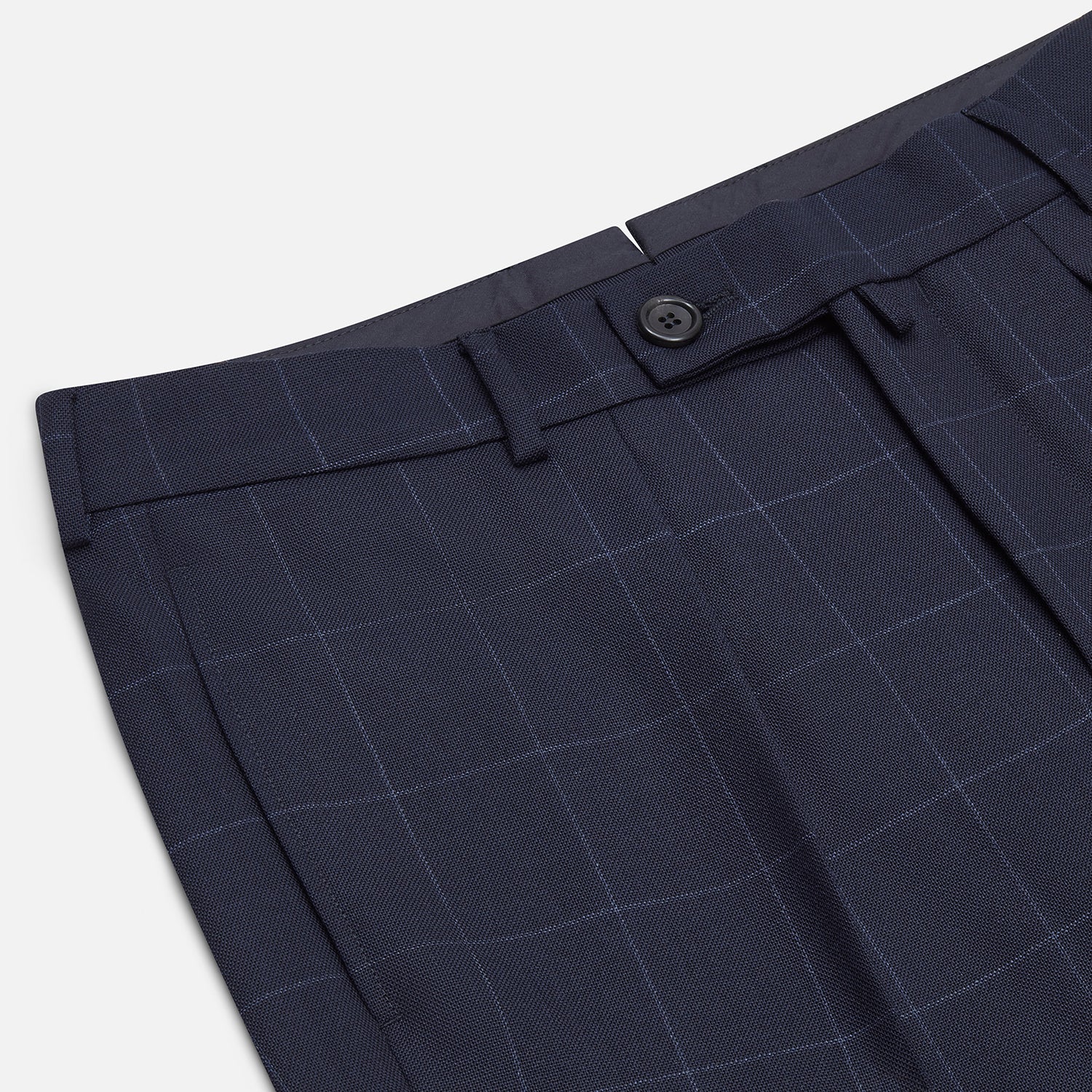 View 2 of product Turnbull & Asser Navy Check Edward Trousers feature a subtle white windowpane pattern, pleated front, belt loops, and button closure, shown against a plain white background.
