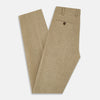 View 5 of product The Sand Linen Amberley Trousers by Turnbull & Asser UK are high-waisted, straight-leg, light brown herringbone linen trousers with belt loops, a front button, and zip closure, shown against a plain white background.