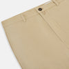 View 2 of product Amberley Sand Trousers in Cotton by Turnbull & Asser UK, featuring a straight-leg silhouette in beige cotton canvas with a button and zip closure, displayed against a plain white background.