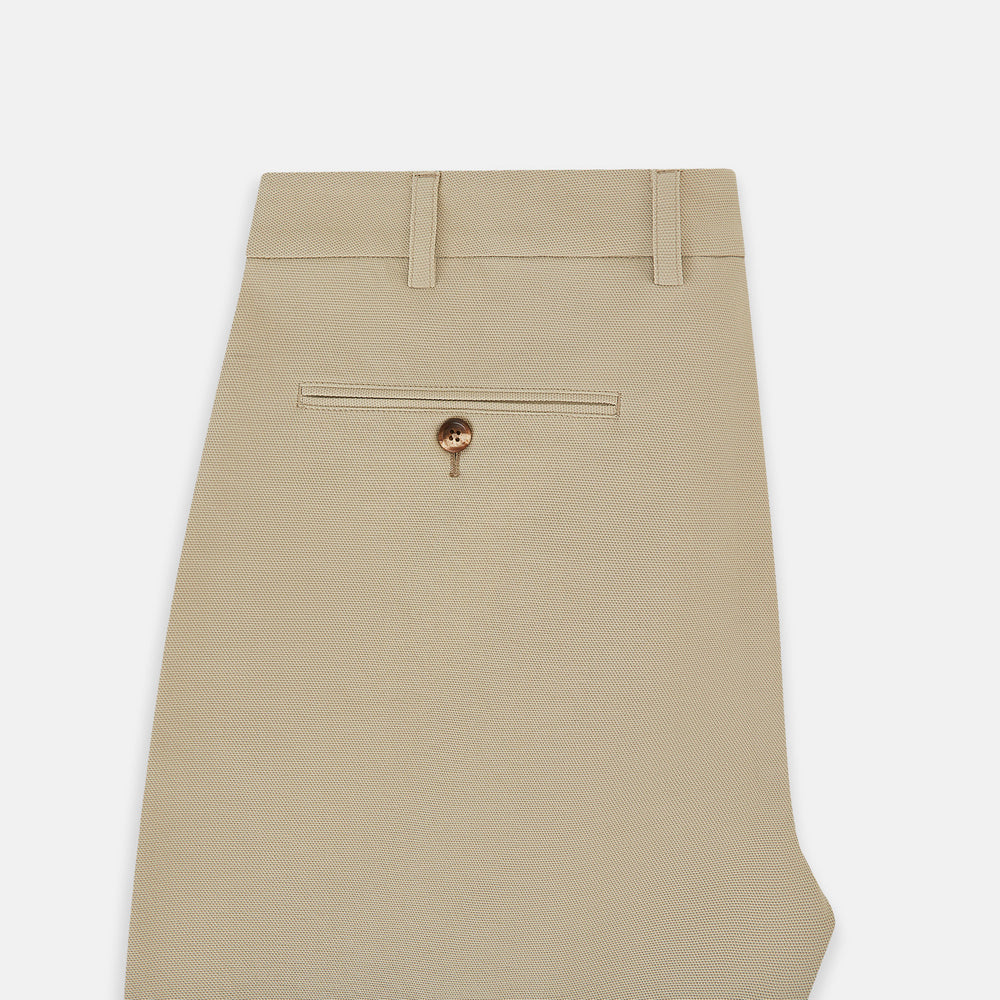 Amberley Sand Trousers in Cotton by Turnbull & Asser UK, featuring a straight-leg silhouette in beige cotton canvas with a button and zip closure, displayed against a plain white background.