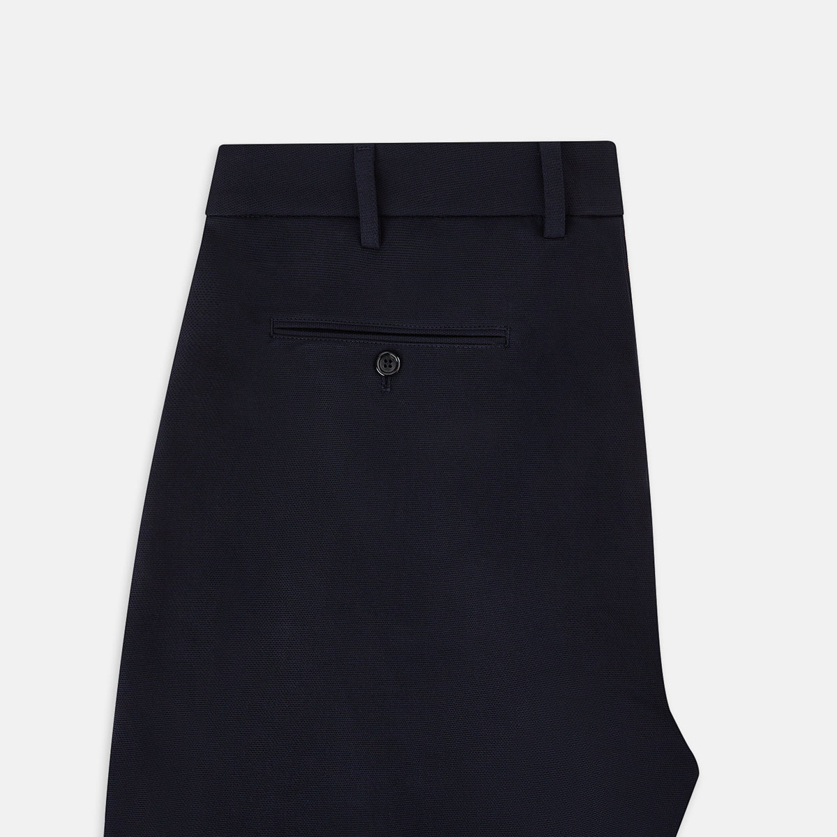 View 4 of product A pair of navy, straight-leg Amberley trousers in cotton by Turnbull & Asser UK, featuring belt loops, a button closure, and a zip fly in the classic Windsor style, displayed on a plain white background.